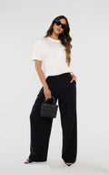 Black Pleated Tailored Pants by Navissi